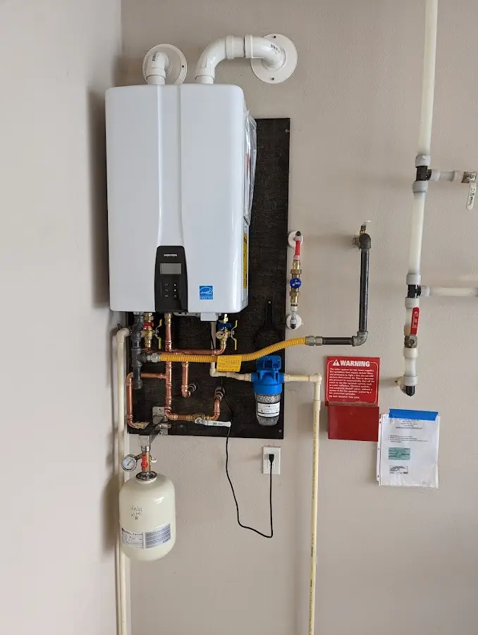 Professional plumber installing copper piping in a Jamul home